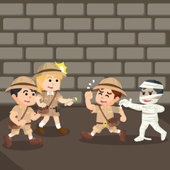 group of explorer running from mummy