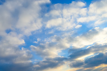 Bright blue sky & puffy clouds as background