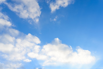 Naklejka na ściany i meble Bright blue sky & puffy clouds as background