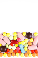 Colorful medical pills and capsules on white background, health care concept, copy space for text