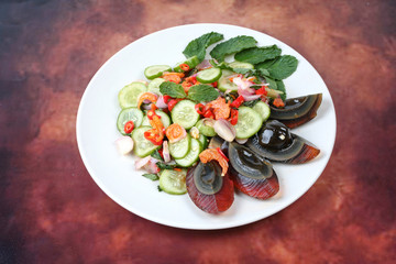 Spicy cucumber salad with dried shrimp and  preserved egg.