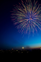 Fototapeta na wymiar Brightly colorful fireworks background
