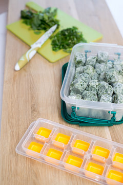 Frozen vegetables and cutting board and plastic containet with f