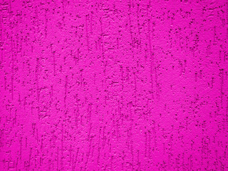 Fragment of the color bright plastered wall with a deep relief.