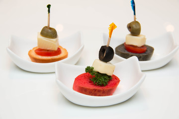  canapes  with  food ingredients served for appetizer