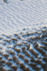 Fototapeta premium Snowdrifts on the river bank