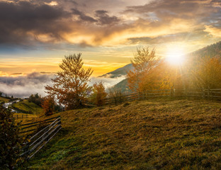 foggy and hot sunset in Carpathian mountains