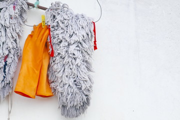 Rag and orange rubber gloves For cleaning