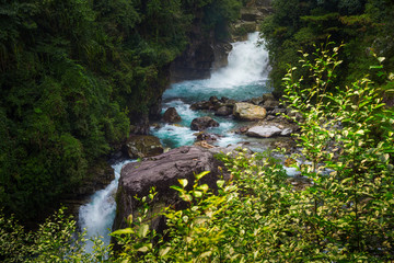 Blue waterfall modi river in Annapurna conservation area ,Nepal.