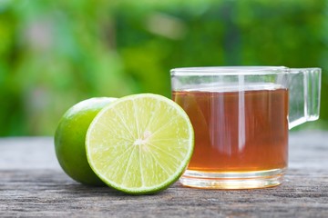 Honey and lime on wood table