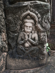 Fototapeta na wymiar Man or god carving on sand stone at Phimai historical park. Pras