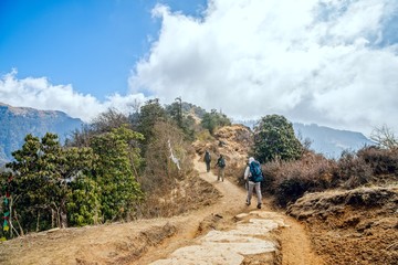 Trekking in Nepal. Group of people trekking on Annapurna mountain region, Nepal