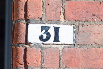 Obraz premium House number 31 painted sign