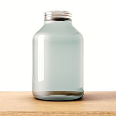 One empty jar of transparent glass with closed metal cap on the wood desk.White wall at background.Clean glassy container. Drinks,food storage concept.3d rendering.