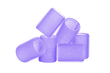 Set of six indigo blue hair curlers isolated on white background