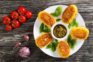 potato pancakes stuffed with chicken meat on white plate