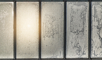 Multi frame window with frozen snowy and icy glass.