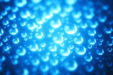 Naklejka na ściany i meble Blue water drops of on treat water-repellent surface in macro lens shot small-DOF for screen wallpapers