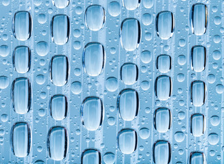 Blue water drops of on treat water-repellent surface in macro lens shot small-DOF for screen wallpapers