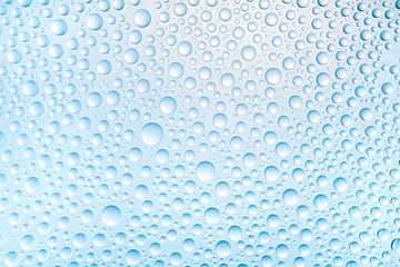 Blue water drops of on treat water-repellent surface in macro lens shot small-DOF for screen...