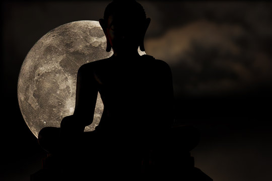 Silhouettes of buddha statue and super moon, Full moon