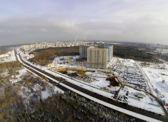 Construction site in the city aerial view at winter