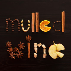 text mulled wine made from slice of orange, spices on the black