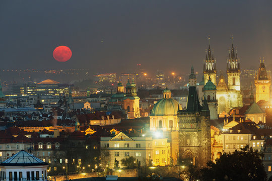 Full moon in Prague Old Town panoramic photo view. Towers of Church of Our Lady before Tyn, Prague, Czech Republic