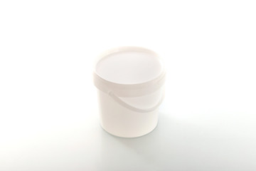 Four blank plastic containers for medicine on white background