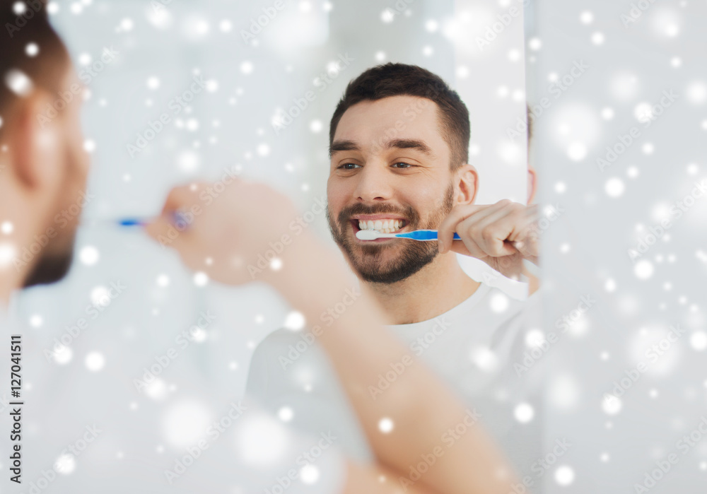 Wall mural man with toothbrush cleaning teeth at bathroom