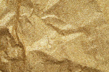 Gold wrinkled paper texture abstract background