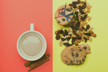 Cup of coffee with cookies and nuts
