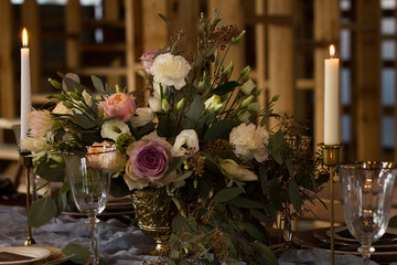 Laid Table By wedding banquet in a barn. Close-up.