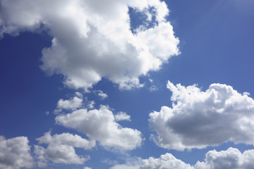 the white clouds floating on a background of blue sky