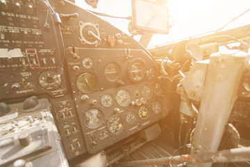 Cockpit with the dashboard, buttons and levers in the sunlight