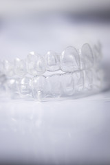 Invisible teeth aligners