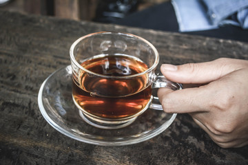 Women drinking hot coffee in coffee shop.selective focus and hip