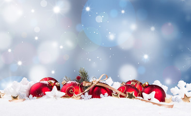 Christmas decoration in snow background with free space. Celebration balls and other decoration. Christmas concept