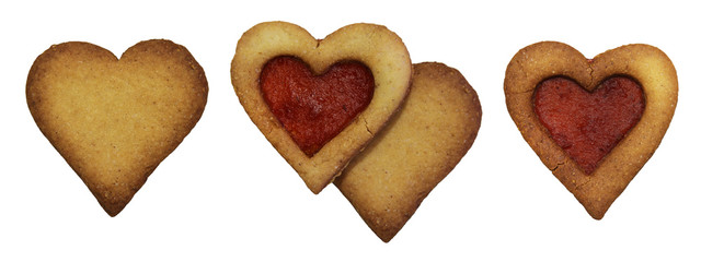 Shortbread cookie with jam filling, in the shape of a heart, isolated on white background
