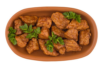Stew in a brown plate. (Goulash) isolated on white background.