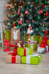 Christmas gifts on the background of trees