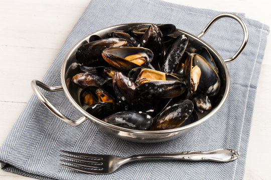 boiled mussels in a metal bowl