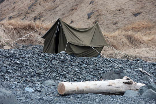 Canvas Tent On The Rocky Shore