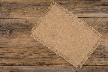 Texture of the old burlap and wood.
