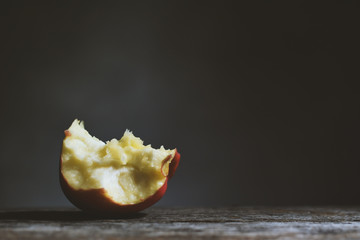 Apple on black background. Vintage tone