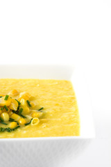 Corn soup in white bowl isolated on white background
