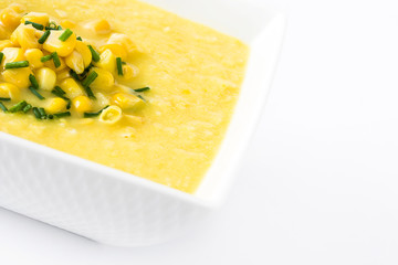 Corn soup in white bowl isolated on white background
