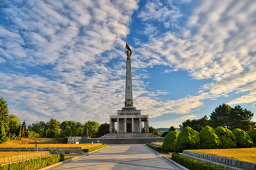 Fototapeta na wymiar Slavin - memorial monument and cemetery for Soviet Army soldiers in Bratislava, Slovakia. With beautiful summer sunset light