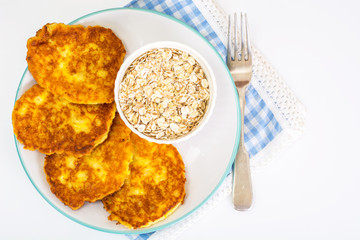 Pumpkin-oatmeal pancakes with curry on a white background