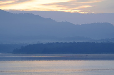 fisherman with layer mountain background